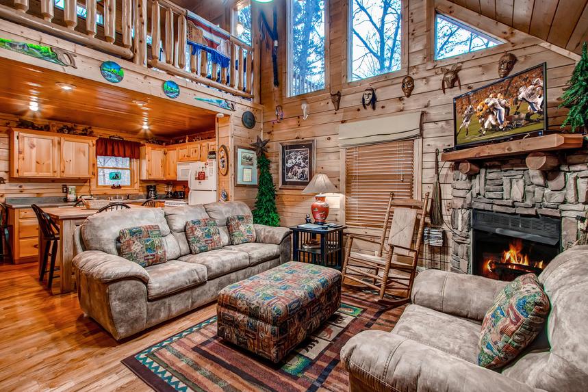 Living room with couches, TV and fireplace